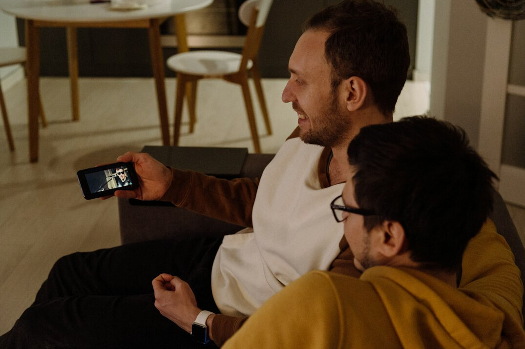 people watching television together